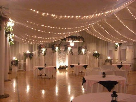 Wedding season is in full swing! And for LDS couples, one great way to keep wedding costs down is by having a reception in the church's cultural hall. Skeptical? Check out these amazing transformations! Lds Weddings Reception, Reception Ceiling, Wedding Ceiling Decorations, Wedding Ceiling, Ceiling Draping, Mississippi Wedding, Wedding Hall Decorations, Lds Wedding, Hall Decor