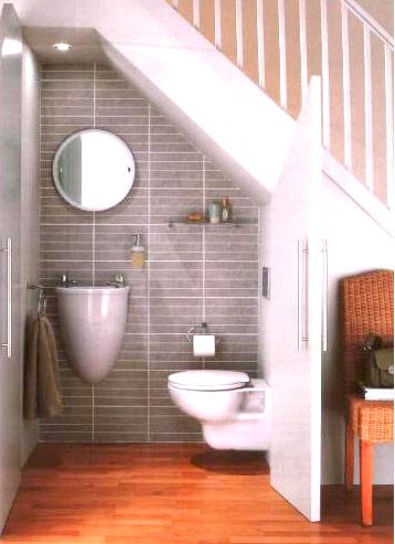 7 Under Stairs Storage Ideas -Bedrooms, Living Rooms & More Tiny Bathroom Sink, Understairs Toilet, Space Under Stairs, Små Rum Lidt Plads, Bathroom Under Stairs, Secret Doors, Under The Stairs, Downstairs Toilet, Bad Inspiration