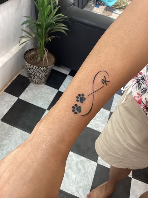 Infinity Tattoo With Dog Paws, Infinity Dog Tattoo, Infinity Tattoo With Paw Prints, Dog Initial Tattoo Ideas, Dog Infinity Tattoo, Dog Tattoo With Name, Paw Wrist Tattoo, Dog Paw Tattoo Design, Hudson Tattoo