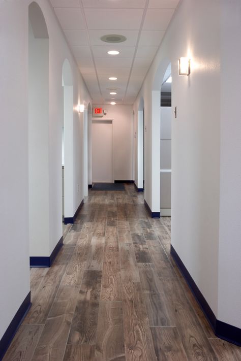 Office Hallway, Dark Baseboards And Trim, Dental Office Flooring, Dental Office Lighting, Dental Clinic Interior Black And White, White Dental Clinic, Cbct Dental Room, Ceiling Dental Clinic, Orthodontic Office Design