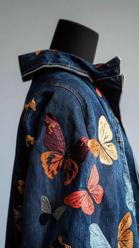 Vibrant hand-painted butterflies design on a classic blue denim jacket, draped over a mannequin, captured in natural light with a soft focus, showcasing intricate details. Diy Denim Jacket Paint Ideas, Painted Denim Jacket Ideas, Jean Jacket Diy Upcycling, Paint On Denim, Denim Jacket Painting, Denim Jacket Design, Denim Jacket Painted, Embroidery Jeans Jacket, Embroidery Jeans Diy