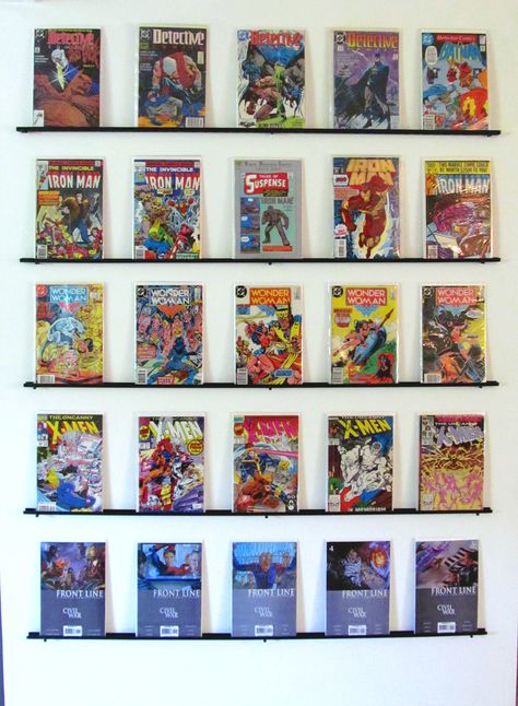 DIY comic book wall display. Just used the wall mount for wire closet organization from Lowes. Painted it black and used screws to secure it into the wall! <3 this! Book Wall Display, Comic Book Bedroom, Diy Comic Book, Comic Book Rooms, Comic Book Crafts, Comic Book Wall, Diy Comic, Comic Display, Comic Book Display