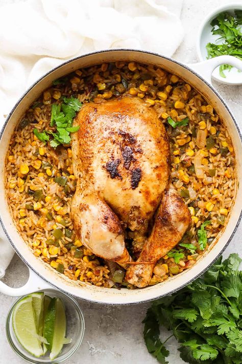 This one pot whole chicken Spanish and rice is the perfect weeknight meal. It's ready in 1 hour and is full of protein and vegetables. Dutch Oven Whole Chicken, Juicy Roasted Chicken, Oven Roasted Whole Chicken, Roast Chicken And Rice, Chicken Wings Crockpot, Whole Baked Chicken, Perfect Grilled Chicken, Rice And Veggies, Easy Chicken Marinade