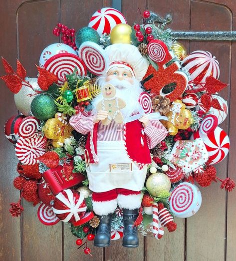 This 60cm Candy Cane Santa Christmas Wreath is the perfect statement piece for Your front door.  Packed with décor in a  peppermint candy theme, finished with Santa Claus. This gorgeous wreath will say a merry little hello to all your guests and loved ones throughout this season. This wreath should be hung in a sheltered position and on a strong hook We take pride in producing unique and luxurious designs. We source the best quality materials available and handcraft each item with the utmost car Christmas Wreaths Candy, Candy Themed Christmas Wreath, Candy Themed Christmas, Gingerbread Santa, Santa Wreath, Candy Theme, Peppermint Candy, Santa Christmas, Door Wreath Hanger