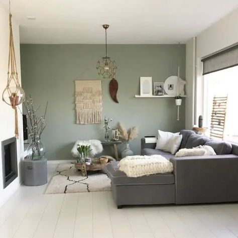 Picture of a boho living room with a green accent wall, a grey sectional, a built in fireplace, a lot of cool and catchy boho home decor Sage Living Room, Sage Green Living Room, Bold Living Room, Green Accent Walls, Living Room Decor Gray, Accent Walls In Living Room, Boho Living Room Decor, Living Room Green, Boho Living Room