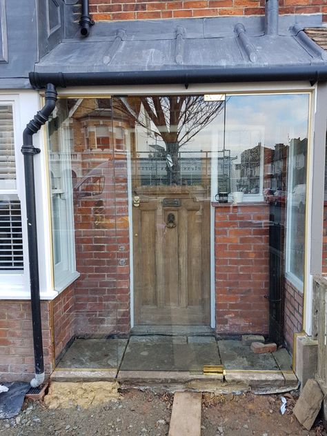 A frameless glass porch with side panels installed to this East Sussex property, providing a usable new space and comfort while showcasing the original Glass Front Porch, Timber Front Door, Bi Fold Doors, Manor Interior, Glass Porch, Porch Interior, Porch Enclosures, Porch Uk, Terracotta Floor