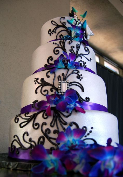 - Fondant wedding cake with purple satin ribbon, black piped scrolls and fresh orchids. The Crafty Cakery, GA Wedding Cake With Purple, Cakes Purple, Peacock Wedding Cake, Round Wedding Cakes, Creative Wedding Cakes, Purple Wedding Cakes, Fondant Wedding Cakes, Peacock Wedding, Beautiful Wedding Cakes