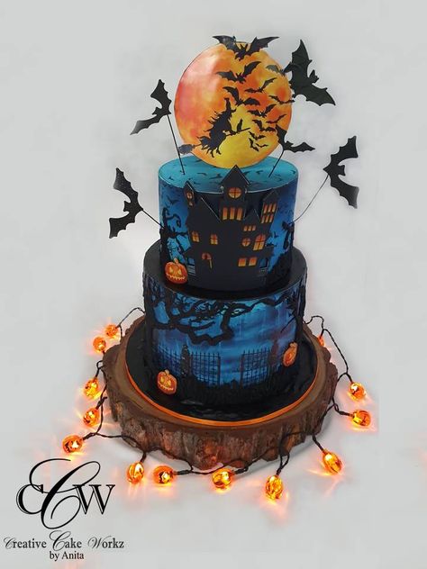 Haunted House Halloween Themed Cake complete with a Spooky Graveyard Scene, Pumpkins, Flying Bats, a Scary Witch and Eerie Lights Halloween Theme Cake, Spooky Graveyard, Graveyard Scene, Haunted House Halloween, Flying Bats, Scary Witch, House Cake, Wood Cake, Halloween Cake