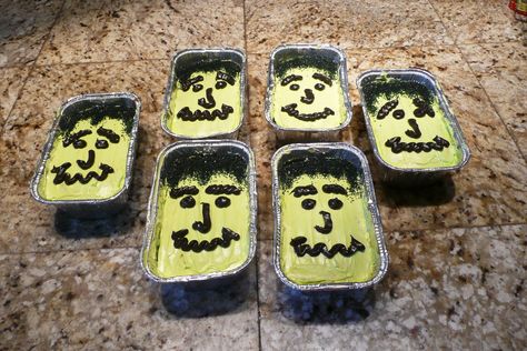 I made chocolate cakes in mini loaf pans for a school cake walk. I made them into Frankenstein faces. I used black sugar (hair), white frosting tinted green (skin) and then used chocolate frosting tinted it black for the face. I got 6 loafs from a standard box cake mix. They were very popular at the event. Halloween Mini Tray Cakes, Halloween Mini Loaf Cakes, Mini Tray Cakes, Mini Loaf Cakes, Loaf Cakes, School Cake, Mini Loaf Pan, Halloween Food Treats, Black Sugar