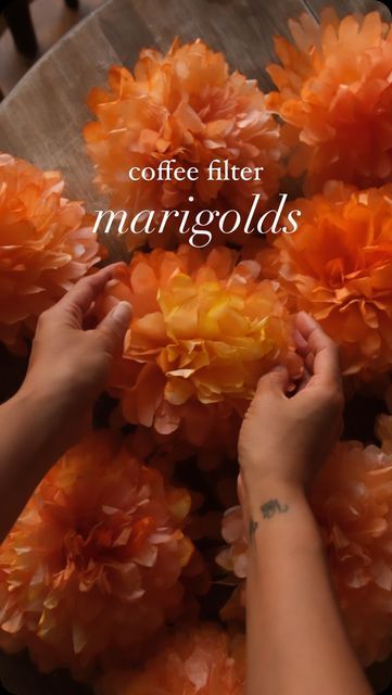 Sibia Torres Padilla | DIYs on Instagram: "These beautiful coffee filter marigolds are a fun craft. My mom taught me how to make them when I was a little girl, and now I get to pass on the tradition to my kids—and to you!

We used to make them with string but my friend @hauz.and.co shared how she staples hers and it’s been a game changer! Check her out 

Materials Needed:
- 8-10 coffee filters per flower
- Water/food coloring mixture (in shades of yellow and orange)
- Stapler
- Scissors

Instructions 
1. Grab a stack of filters. Fold them in half 3 times and cut a scalloped edge. 

2.Dip your coffee filters into a water/food coloring mixture. Let them soak for a few seconds until the color spreads. You can mix shades of yellow and orange for a vibrant, realistic marigold look. Lay them out Diy Paper Marigold Flower, Coffee Filter Crafts Fall, How To Dye Coffee Filters, Marigold Paper Flowers Diy, Cone Coffee Filter Crafts, Marigold Flower Art, Coffee Filter Marigolds, How To Make Marigold Paper Flowers, Paper Marigolds Diy