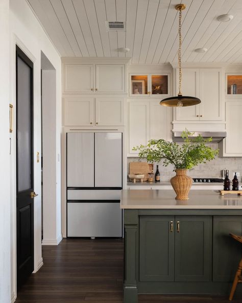 Kitchen with cream top cabinets and green cabinets on kitchen island. Half Green Kitchen Cabinets, Kitchen Inspo Green Cabinets, Cream And Green Cabinets, Kitchen Ideas Green Island, Beige Cabinets Green Island, Green And Ivory Kitchen Cabinets, Cream Kitchen With Green Island, Green And Beige Cabinets, Greige And Green Kitchen