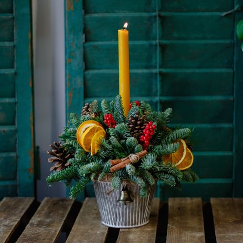 Our Gingerbread Centrepiece is an elegant way to add festive cheer to your special occasion. Its intricately crafted design of luxury ingredients—cinnamon sticks, oranges, ilex berries and warm, rich tones—creates a unique atmosphere to stoke the holiday spirit. Enjoy the comforting, delicious scent and spread joy around with this timeless centrepiece! Don't forget to never leave the candle unattended. Please note, container style may vary. Xmas Table Centrepiece Ideas, Festive Floral Arrangements, Christmas Table Centres, Modern Christmas Floral Arrangements, Xmas Centrepiece, Christmas Lanterns Decorated Diy, Christmas Floral Centerpieces, Ilex Berries, Christmas Centrepiece Ideas