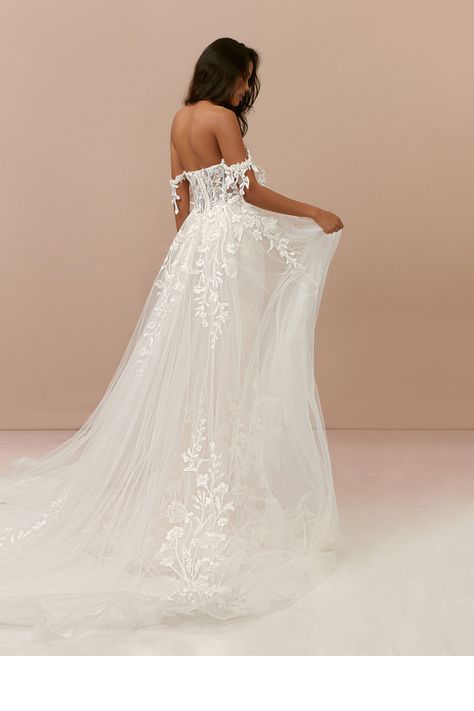 Make your guests gasp in awe as you walk down the aisle in Evergarden. She is a lace and tulle mermaid dress with a sweetheart neckline and removable off-the-shoulder straps. Her see-through illusion bodice with a dropped waistline features boning to help cinch in your waist. The dress also features a stunning removable overskirt for you to have two looks in one. Azazie Wedding Dresses, Glamorous Wedding Dress, Watters Wedding Dress, Floral Lace Wedding Dress, Glam Wedding Dress, Contemporary Wedding Dress, Wedding Dress Low Back, Trendy Party Dresses, Train Dress