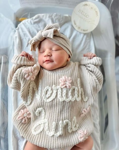 Little Miss 🤍🤍Neriah June🤍🤍 is completely PRECIOUS all snuggled in her custom sweater!! Such a perfect blessing with the most beautiful face. Welcome to the world, sweet angel!!! #themodmango #themodmangobabyco #babysweater #babynameannouncement #newborngift #newborngiftideas #babygirlsweater #newbornsweater #milestonesweater #handembroidery #handembroidered #custombabyboutique Newborn Going Home Outfit Girl, Baby Sweater With Name, Embroidered Baby Sweater, Newborn Hospital Outfit, Sweater With Name, Personalized Newborn Outfit, Baby Hospital Pictures, Newborn Hospital Outfits, Name Sweater