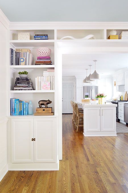 Young House Love | Adding Built-In Bookshelves Around Our Living Room Doorway | http://www.younghouselove.com Small Basement Remodel, Refinishing Hardwood Floors, Small Basements, Kitchen And Dining Room, Built In Bookcase, Living Room Remodel, Room Remodeling, Basement Remodeling, Front Room