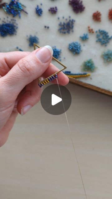 Mile High Beads ~ Kari on Instagram: "A quick look at how I attach the beads to the frame for my Art Deco Fringe Earrings. 🪡   Not only was I lucky enough to get to send out a pair of Art Deco Fringes yesterday, but I have another pair on my Orders-To-Make List, too! 🤗 Thank you so much for keeping me busy! 💓 . . . . . . . . . . . . . #seedbeads #seedbeadjewelry #beadweaving #jewelrymakers #seedbeadearrings #fringeearrings #milehighbeads #makingjewelry #jewelrymakingprocess #processvideo" How To Make Fringe Bead Earings, How To Make Beaded Fringe Earrings, Diy Beaded Hoop Earrings Tutorials, How To Make Fringe Earrings, Fringe Earrings Diy Tutorials, Seed Bead Fringe Earrings Tutorial, Bead Fringe Earrings Tutorial, Seed Bead Fringe Earrings Pattern, Diy Seed Bead Earrings Tutorials