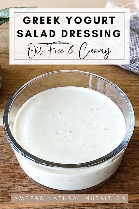 Greek yogurt dressing in a glass ramakin on a wood chopping board