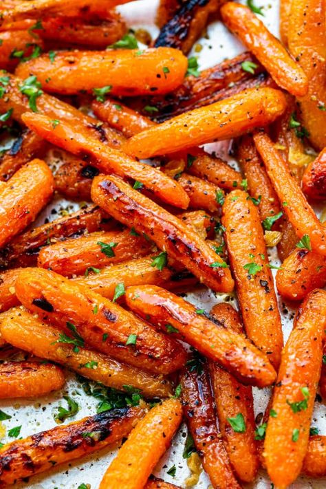 The combination of sweet and savory in these honey garlic roasted carrots is exactly the flavor you crave in a side dish! #roastedcarrots #carrotsrecipe #honeyroastedcarrots Honey Garlic Butter Roasted Carrots, Honey Carrots Roasted, Carrots On Grill, Honey Roasted Carrots Oven, Roasted Carrotts, Honey Garlic Carrots, Thanksgiving Carrots, Honey Garlic Roasted Carrots, Garlic Roasted Carrots