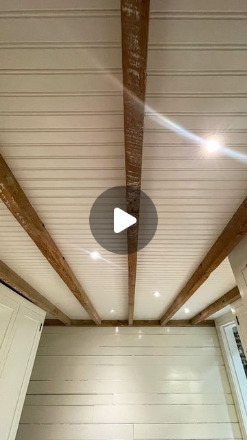 Alex & Wendy Santantonio on Instagram: "This #beadboard ceiling is one of the projects we’re most satisfied with. 
•
When working on our laundry room we set out to keep as much ceiling height as possible, cover the insulation, keep the joists visible, and add a little interest to the basement. The result, our recessed beadboard ceiling 😍🤌🤌🤌
•
The process was a relatively simple but very tedious one. Furring strips to support the beadboard, then measure, cut, fit, trim, fit, nail, repeat. Some people suggested using the beadboard plywood to reduce the need for individual pieces, but that would have been 10x harder. The joists are old, slightly twisted, and not straight, so the cuts to get a good and tight fit would have been very difficult. Also, if we ever have an issue behind the ceil B Board Ceiling, Beadboard Ceiling With Shiplap Walls, Beadboard Ceiling Bedroom, Porch Ceiling Ideas Cheap, Exposed Ceiling Joists, Floor To Ceiling Beadboard, White Plank Ceiling, Stained Beadboard Ceiling, Beadboard Porch Ceiling