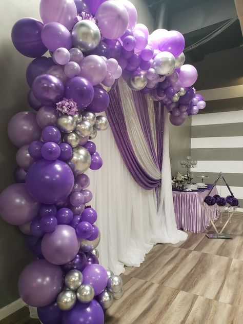 Purple balloons and white sheer backdrop Purple Retirement Party Decorations, Purple Debut Backdrop, Purple White Silver Balloon Garland, Purple And Gold Balloon Backdrop, Purple Party Backdrops, Silver And Purple Balloons, Sheer Curtain Backdrop With Balloons, Purple And Silver Prom Decorations, Lilac White And Silver Party Decor