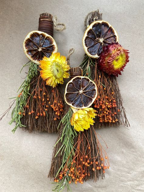 1 hand-dressed cinnamon scented broom / bessom with florals for Mabon, Samhain / Halloween and harvest season. Altar offering or pagan decor. Folk craft.  Hand dressed and intentionally made cinnamon broom with home grown, organic, and traditionally dried lemons from my southern Californian apothecary. Dressed with other beautiful fall elements to celebrate the fall season.  Cinnamon has long been valued for its protective and spiritual awakening properties as well as adding a little extra fire Halloween Altar, Samhain Decorations, Samhain Altar, Cinnamon Broom, Pagan Yule, Vintage Fall Decor, October Holidays, Pagan Decor, Samhain Halloween