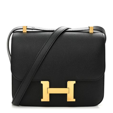 This is an authentic HERMES Epsom Constance 24 in Black. This stylish shoulder bag is finely crafted of epsom calfskin leather in black. The bag features a cross-body strap with gold plated hardware including an H buckle at the front flap. The flap opens to a compact partitioned black leather interior with flat and zippered pockets. Dream Handbags, Hermes Constance Bag, Hermes Constance, Stylish Shoulder Bag, Hermes Handbags, Hermes Bags, Hermes Bag, Leather Interior, Cross Body