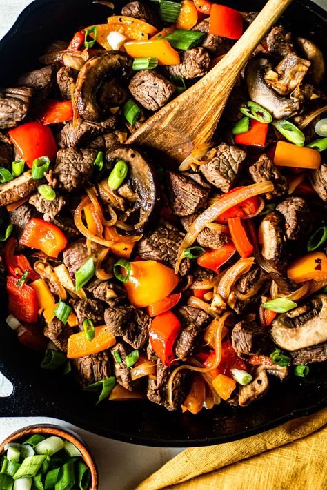 One Skillet Beef Tips with Peppers and Onions - ghee/avocado oil (might reduce), sirloin steak, salt, black pepper, ACV, garlic cloves, red bell pepper, orange bell pepper, yellow onion, sliced baby bella mushrooms, green onion (for garnish) Recipe For Beef Tips, Crock Pot Beef Tips, Resep Steak, Beef Tip Recipes, Crock Pot Beef, Easy Whole 30 Recipes, Steak And Mushrooms, One Skillet Meals, Soup Broth