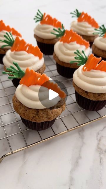 Kelly Senyei | Just a Taste® on Instagram: "CARROT CUPCAKES WITH CREAM CHEESE FROSTING! 🥕

Raisins do not belong in carrot cake. 🙅🏼‍♀️ Agree or disagree? 

These super-moist Carrot Cupcakes are loaded with freshly grated carrots and crushed pineapple, and are topped off with tangy cream cheese frosting and candy melt carrots. 🙌🏻 Because it’s never too early to jump into all the spring sweets!

👉🏻 COMMENT with the word CARROT and I’ll DM you the clickable recipe link!

#carrotcake #carrotcakerecipe #carrotcupcakes #wiltoncakes #eastercake #easterready #cupcakedecorating" Carrot Cake Cupcakes Easter, Piping Carrots On Cake, Carrot Cake Cupcakes Decorating Ideas, Carrot Cake Decorating Ideas, Spring Sweets, Carrot Cake Decoration, Easy Cupcakes Decoration, Candy Melt, Decorated Cupcakes