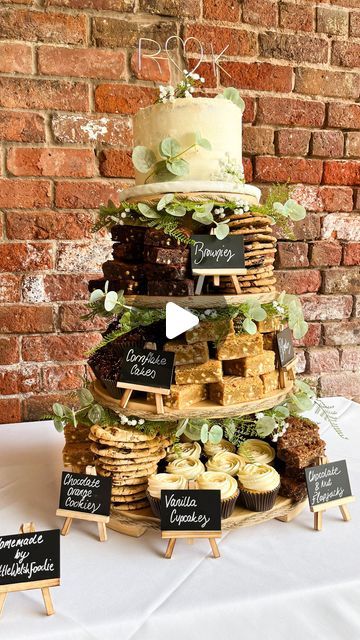 Naomi Spaven on Instagram: "Kate & Ricky’s Wedding Cake Tower 🫶🏼  Making these wedding cakes is possibly my favourite thing that has come from Little Welsh Foodie🥹  Getting to chat with the couples before hand and discuss what bakes and flavours are their favourite, right through to sitting with my dad sticking rope and leaves to the stand…I just love the whole process🫶🏼  Kate & Ricky had a beautiful wedding and I was so grateful to not only provide the cake, but also spend the evening at the wedding, chatting with people about the bakes and watching people demolish it😂  ON THE STAND: 🍰 3 Layer Victoria Sponge Cake 🍪 Vegan Chocolate Orange Cookies 🌾 Gluten + Dairy Free Choc Nut Flapjacks ✨ Cornflake Cakes (personal fave) 🍫 Triple Chocolate Brownies 🤍 White Chocolate Blondies 🧁 Welsh Cake Wedding Cake, Chocolate Brownie Wedding Cake, Wedding Cake With Cookie Tiers, Wedding Cake Dessert Ideas, Wedding Cake With Brownies, Wedding Brownie Cake, Wedding Cake 50 People, Coffee Cake Wedding Cake, Brownie Dessert Bar Wedding