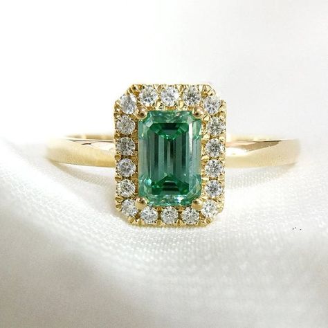 Hey, I found this really awesome Etsy listing at https://www.etsy.com/listing/944161831/green-moissanite-ring-14k-yellow-gold Emerald Green Ring, Yellow Gold Moissanite Ring, Moissanite Halo Engagement Ring, Green Moissanite, Halo Engagement Ring Sets, Moissanite Engagement Ring Halo, Sparkly Ring, Emerald Ring Gold, Emerald Cut Engagement