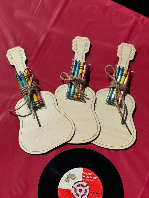 Add a creative and musical touch to your next party with these Wooden Laser Cut Guitar Coloring Boards! Makes the perfect music lover party favors for all your music themed parties! Each set comes with a selection of vibrant crayons, making it easy for guests to personalize their guitars with their favorite colors. Whether you're hosting a birthday party, a music-themed event, or just looking for a fun activity, these coloring boards are sure to strike the right chord. Unleash your inner artist Music Crafts For Adults, 2nd Birthday Music Theme, Johnny Cash Themed Birthday Party, Music Themed Decorations, Classic Rock Birthday Party, Musical Themed Birthday Party, Rock And Roll Theme Party Decorations, Music Themed Crafts, Band Themed Party