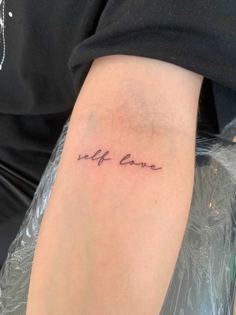 Self Love In Cursive Tattoo, Love Tattoo Aesthetic, Love Your Body Tattoo Ideas, Self Love In Cursive, Self Love Cursive Tattoo, Dainty Tattoo Quotes, Loved Tattoo Word, Self Love Quote Tattoo, Sweet Life Tattoo