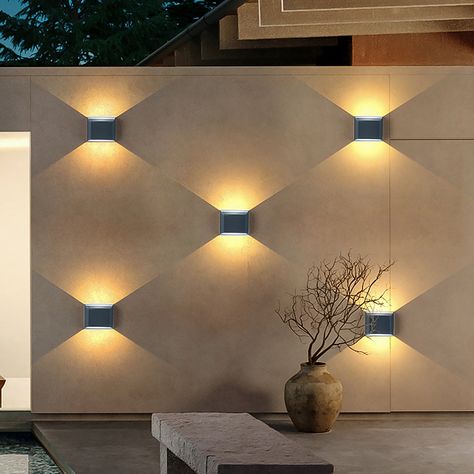 The upper and lower ends are symmetrically illuminated, forming a unique and beautiful light and shadow, so that the outdoor lighting is not monotonous, which adds light to your outdoor walls and adds a chic decoration. The light from this wall sconce is bright but not harsh. The combined installation of multiple wall lamps can achieve unique layout effects, and you can even DIY your own desired lighting effects. The aluminum lamp body is wear-resistant and durable, and the junction of ... Vogue Decor, Blitz Design, Porch Light Fixtures, Outdoor Lighting Design, Decorative Wall Sconces, Wall Lighting Design, التصميم الخارجي للمنزل, Exterior Wall Light, Led Outdoor Wall Lights