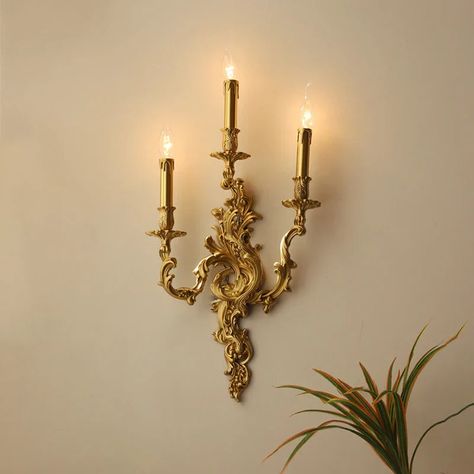 Introducing the Afralia™ Antique Brass Wall Sconces, a timeless piece that combines vintage charm with a touch of royal elegance. Crafted with exquisite attention to detail, these French-inspired wall lamps exude a sense of sophistication and luxury, making them the perfect addition to any space. Illuminate your surroundings with the warm glow of LED bulbs, creating a welcoming ambiance in your kitchen, dining room, bedroom, foyer, study, or corridor. The classical design, featuring up & down sh Vintage Wall Lights Living Room, Wall Antique Decor, Antique French Interior Design, Antique Gold Light Fixtures, Vintage Lights Aesthetic, Antique Wall Lamp, Antique Kitchen Lighting, Indoor Wall Sconces Living Room, Dark Academia Light Fixture