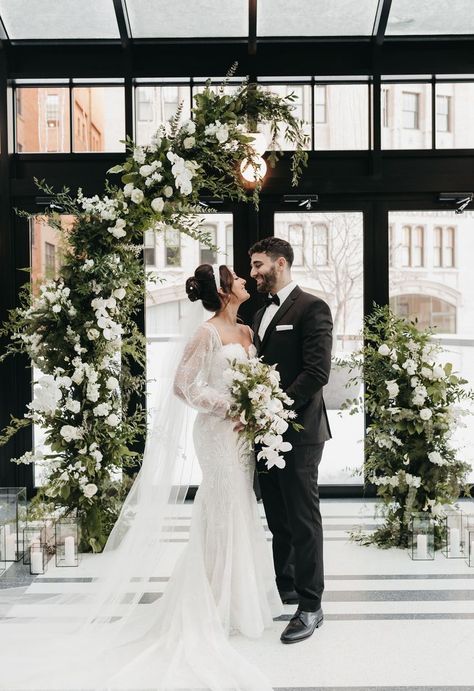 Greenery, Candles, Black and White, Winter, Romatic, Arch, Asymmetrical Photo // @stintography Venue // @shinolahotel Floral // @parsonageevents Winter Wedding Arch, White Wedding Arch, White Winter Wedding, Winter Candle, Black And White Wedding, Black White Wedding, Floral Arch, Art Deco Wedding, Wedding Arch