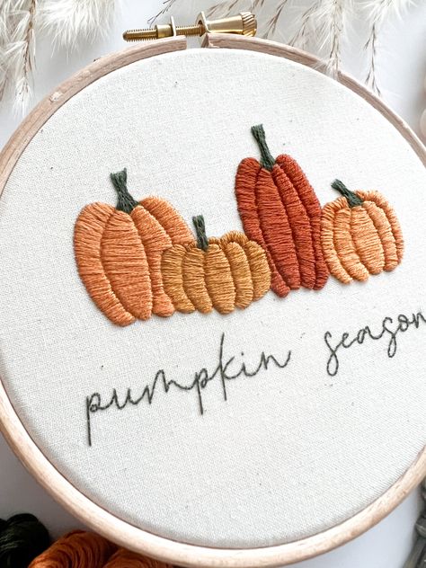 Pumpkin Season Digital Embroidery Pattern with Instructions I'm always inspired by the seasons, and this pattern is no different! With this intermediate 5" hoop, you can create some seasonal pumpkin goodness too.*Please Note: This is a PDF Digital Download that you can download after purchase. You will not receive a physical shipped product by purchasing this pattern.*This pattern has been created for a beginner to embroidery - no prior understanding of embroidery is required! With the Free Guid Fall Embroidered Shirts, Halloween Hand Embroidery Patterns Free, Embroidery Patterns Shirt, Pumpkin Embroidery Patterns Free, Hand Embroidery Pumpkin, Pumpkin Embroidery Designs, Autumn Embroidery Designs, Fall Embroidery Ideas, Halloween Embroidery Ideas