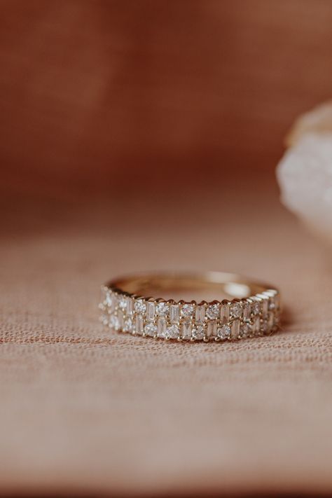 14k gold band with two rows of .53 cts of baguette and round diamonds, set in prongs in an alternating pattern. Available in rose, yellow, or white gold. Gold Baguette Ring, Baguette Diamond Ring, Stacked Wedding Bands, Ring Baguette, Baguette Diamond Rings, Baguette Ring, Round Diamond Ring, Dream Engagement Rings, Unique Wedding Bands