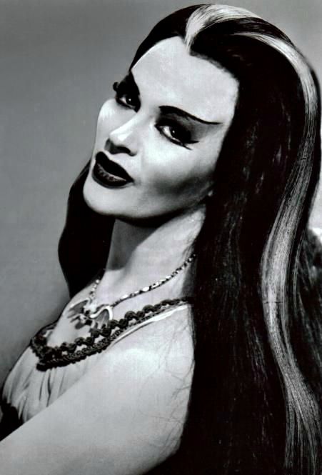 Full Name: Lily Dracula Munster Age: Varies (but more than 137 years old) Birthplace: Transylvania Appearance: Vampirelike; silver streak in hair Siblings: Brother Lester and unnamed sister Abilities: Reading palms and cooking Occupation: Full-time housewife Preferences: Wears Chanel No. 13 perfume ("the most exotic") Noticeable Qualities: Undying devotion to husband and family; sensitivity http://www.munsters.com/lily_munster.php Cultura Punk, The Munster, Lily Munster, Yvonne De Carlo, Elvira Mistress Of The Dark, Rooney Mara, Album Foto, The Munsters, Classic Monsters