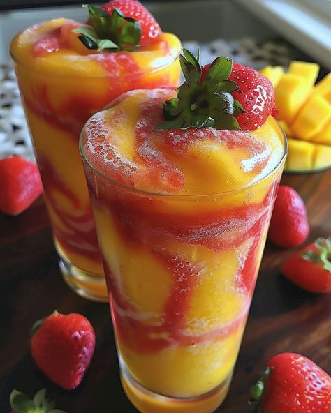 A lovely start to your morning or as a refresher on a hot summer day. Try this Fresh Mango Strawberry Slushie.... https://northeastnosh.com/fresh-mango-strawberry-swirled-slushies/ #northeastnosh #slushie #smoothie #mango #strawberry #mangodrink #strawberrydrink #summerdrink #refresher #food #foodie Avani Recipes, Strawberry Slushie, Strawberry Mango Smoothie, Comfort Food Chicken, Fresh Orange Juice, Strawberry Drinks, Frozen Mango, Buttered Noodles, Mango Chunks