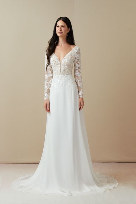 Breathtakingly unique and statement-making, this A-line wedding dress is both sensual and modest for the most unforgettable fall or winter wedding day look. Her lace appliqued bodice is covered in the light-catching botanical beading. The lace applique flows stunningly onto the semi-transparent full length sleeves and chiffon skirt. Her lightweight skirt is finished with a sweep length train. Boho Elegant Wedding, Elegant Long Sleeve Wedding Dresses, Wedding Dresses Diamonds, Sweep Train Wedding Dress, Mahal Kita, Long Sleeve Wedding Dress Lace, Wedding Dress Lace, Winter Wedding Dress, Sleeve Wedding Dress