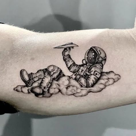 Astronaut Tattoo Ideas Astronaut Arm Tattoo, Funny Astronaut Tattoo, As Above So Below Tattoo Astronaut, Galaxy Chest Tattoo Men, Realistic Astronaut Tattoo, Space Patchwork Tattoo Sleeve, Astronaut Sitting On Planet Tattoo, Spaceman Tattoo Design, Space Arm Tattoos For Women