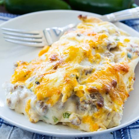 Southern Breakfast Enchiladas with Sausage Gravy - Spicy Southern Kitchen Lasagne Roll Ups, Cheese Mushrooms, Spicy Southern Kitchen, Southern Breakfast, Breakfast Enchiladas, Lasagna Roll, Southern Kitchen, Philly Cheesesteak, Pasta Pasta