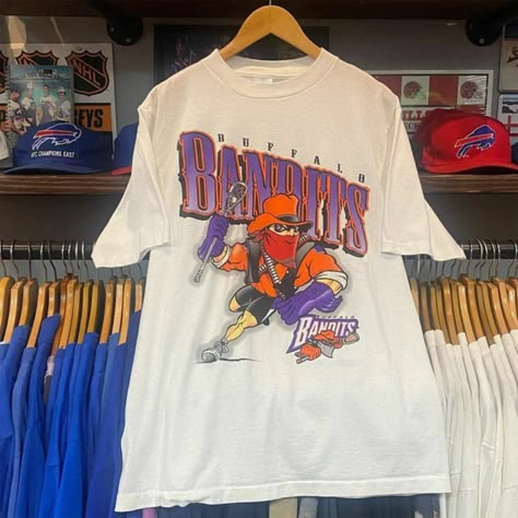 Vintage Nhl 1996 Buffalo Bandits Shirt, Unisex T-Shirt Sweatshirt Hoodie, Vintage Shirt For Men Women, Birthday Gift, Graphic Tees, Fan Gift Reprinted Shirt Made By Gildan Brand 5.3-Ounce, 100% Cotton (99/1 Cotton/Poly (Ash) & 90/10 Cotton/Poly (Sport Grey) Heavyweight Classic Unisex Tee Taped Neck And Shoulders; Tearaway Label Decoration Type: Digital Print Vintage Sports Tshirt, Vintage Sports Shirts, Vintage Sports Tees, Buffalo Bandits, Vintage College Shirts, 90s Basketball, Basketball Tshirt, College Shirt, College Apparel