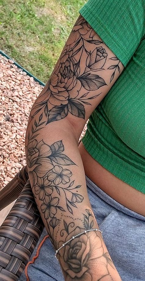 9998 Close-up of a woman's arm with detailed floral tattoo, wearing a green top and gray pants, sitting outdoors on a wicker chair. | Sky Rye Design Half Sleeve Tattoos Forearm, Arm Sleeve Tattoos For Women, Tattoo Leg, Floral Tattoo Sleeve, Forearm Tattoo Women, Leg Tattoos Women, Pretty Tattoos For Women, Feminine Tattoo, Arrow Tattoo