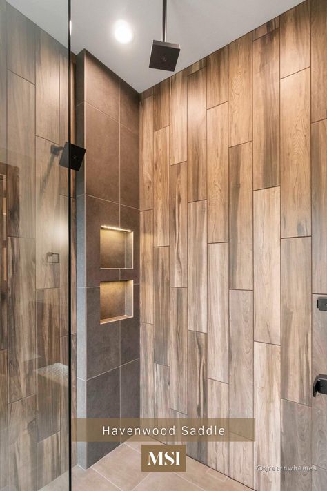 Create a dream shower with wood-look porcelain tile. Havenwood Saddle Wood features warm golden brown grain and chocolate knots that compliments every design stile without the maitenance or fuss of other materials! Porcelain Wood Tile Shower Walls, Shower Tile Ideas Wood Look, Wooden Tiles Shower Wall, Wood Looking Shower Tile, Vertical Wood Tile Shower Ideas, Wood Plank Tile Shower Wall, Wood Grain Tile Shower Wall, Wood Grain Shower Tile, Shower With Wood Look Tile