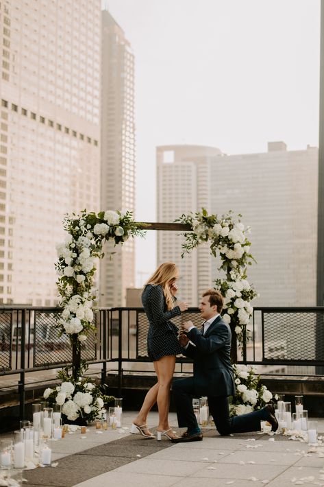 Chicago Rooftop Proposal Flowers and Candles Rooftop Engagement Party, Proposal Places, White Proposal, Social Table, Proposal Aesthetic, Wedding Proposal Ideas Engagement, Arch Ways, Savannah Elopement, Surprise Proposal Pictures