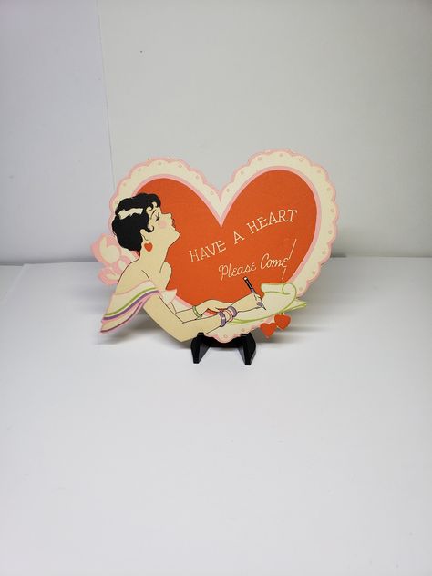 Darling vintage 1920's-30's unused super bright and colorful Art Deco die cut heart shaped red and pink valentine party invitation. Measures 4 1/2 x 3 1/2 in. There is a very light penciled 1- on the back. Overall in near mint condition. Darling and very colorful graphics. No makers mark but looks like a Gibson or Henderson Line to me. I have 3 available for individual sale. First class shipping is free, combined fees on multiple purchases 1950s Valentines, Vintage Valentine Heart, Colorful Art Deco, Valentine Party Invitations, Bridge Tally Cards, Art Deco Ladies, Vintage Valentines Decorations, Shape Of Heart, Vintage Valentines Day