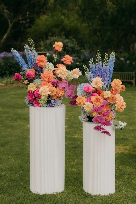 Bright Pink + Barefoot: A Fun + Floral Wedding In Australia How To Wedding Floral Arrangements, Bright Pastel Flower Arrangement, Bright Pink Flowers Wedding, Bouquet Styles Wedding, Blue Pink Orange Bouquet, Wedding Ideas Bright Colors, Summer Wedding Ideas Indoor, Wedding Arch Bright Flowers, Floral Alter Wedding