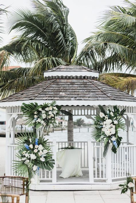 Florida Outdoor Ceremony Gazebo with Tropical Floral Arrangements | Palm Frond White and Greenery Decor | St. Pete Wedding Venue Isla Del Sol | Natural Watercolor, White Gazebo, Gazebo Decorations, St Pete Wedding, Tropical Floral Arrangements, Greenery Decor, Gazebo Wedding, Florida Wedding Venues, St Pete Beach