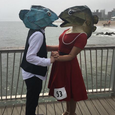 "We used your Fish Head to make masks for the 2017 Mermaid Parade in our hometown of Brooklyn, New York. Our costumes were a HUGE hit and we got a LOT of people asking for pictures as well as some TV and news coverage!!" - Val and Nick Cardboard Costume Ideas, Head Mask Design, Complicated Halloween Costumes, Obscure Costumes, Paper Mache Costume, Holding Mask Reference, Koi Fish Costume, Really Simple Halloween Costumes, Ocean Themed Costumes